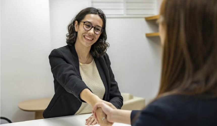 A young woman shaking hands with the recruiting manager after the interview.